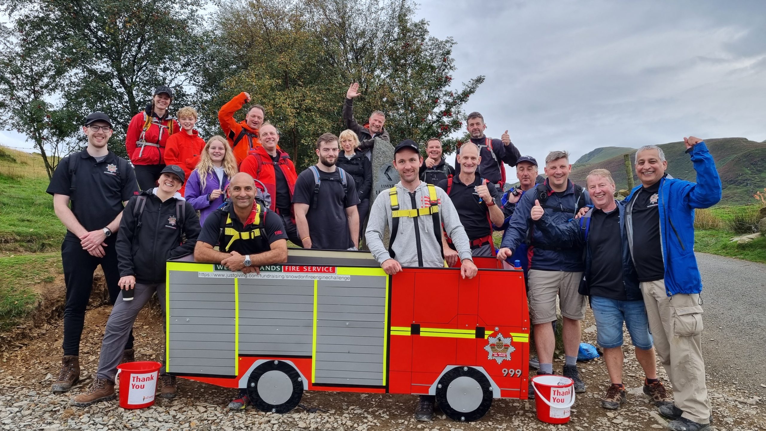 Team carry mini fire engine up mountain in aid of Charity